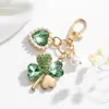 Llavero de Trébol de Cuatro Hojas con Pedrería Moda Europea y Americana Transfronteriza Colgante de Perla en Forma de Corazón Accesorios para Llavero de Bolso de Niña