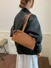 Bolso de mano de gamuza retro simple coreano para mujer Otoño/Invierno 2026 Nuevo para el trabajo Gran capacidad Hombro único Bolso de axila