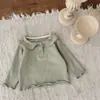 INS otoño e invierno bebé tejido fino muñeca solapa manga larga top bebé niña tapeta interior camiseta base