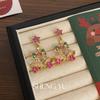 Pendientes de campana navideña de estilo transfronterizo europeo y americano, exquisitos pendientes de lujo ligeros con diseño de nicho con incrustaciones de diamantes y estrellas de colores.