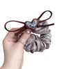 Goma para el pelo de malla con lazo de corazón color marrón claro estilo Dongdaemun coreano, nuevo modelo 2026 con un toque de alta gama para peinados de coleta