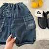Calça Longa Infantil 2026 Chegada Nova Outono Unissex Cor Sólida Bolso Calça Cargo Jeans Bordado para Bebê