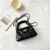 Bolso de cadena con patrón de rombos para mujer, nuevo modelo 2026, diseño de nicho para el trabajo, bolso de hombro texturizado, bolso pequeño cuadrado cruzado