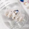 Popular en línea popular joyería para uñas Corazón Torcido Diamante nuevo Super Brillante Aurora color mágico encantador uña Diamante corazón de melocotón diamante al por mayor