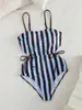 Traje de baño de una pieza para mujer, moda europea y americana de verano, para playa, con rayas, sin espalda, hueco, atuendo para vacaciones y fiesta