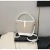 Bolso de Hombro Multicolor Transfronterizo para Mujer 2025 Estilo Nuevo Bolso de Mano Simple y Elegante Bolso Cubo con Diseño de Candado Bolso Cruzado de Nicho
