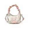 Bolso de mano de gato dulce y lindo estilo coreano, un bolso cruzado mini y único para madres e hijas, con un diseño plisado y una sensación moderna, ligera y lujosa.