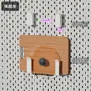 El tablero perforado de metal engrosado de IKEA se puede fijar magnéticamente a la pared, sirviendo como un estante de almacenamiento sin borde y se puede fijar magnéticamente