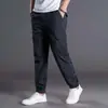 Atacado do fabricante comércio exterior calças esportivas casuais masculinas para primavera e verão, cor sólida, corte solto, tamanho europeu, calças jogger soltas