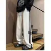 Pantalones deportivos a rayas de estilo americano de moda para hombre, 2026 nuevos pantalones casuales holgados rectos de pierna ancha de alta costura