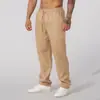 Pantalones Deportivos de Ocio para el Hogar de Estilo Europeo y Americano Transfronterizos para Hombre de Algodón Transpirable de Color Sólido Holgados Modernos de Algodón y Lino