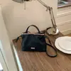 Bolso de mujer 2026 nuevo bolso de hombro cruzado texturizado de moda bolso nube de cuero suave bolso de mano con bloques de color bolso cubo de la suerte