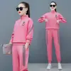 Conjunto Esportivo Casual Tendência com Gola Alta Solto para Mulheres Primavera Outono Novo Estilo Manga Longa Calça Longa Moletom Estiloso Conjunto Elegante de Duas Peças