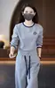 Traje de dos piezas para mujer 2025, estilo extranjero nuevo, estampado a juego de colores, suéter Joker casual de moda para primavera y otoño, pantalones de pierna ancha