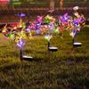 Lámpara solar de suelo con forma de mariposa y árbol de flores, ideal para patio, césped, ambiente festivo, decorativa, para exteriores, con ramas de flores artificiales.
