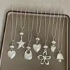 Estilo Minimalista Colgante de Corazón y Estrella Mate Collar Largo, Único y de Nicho, Apilable, Cadena para Suéter Fresca y Versátil