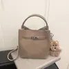 Bolsa Saco Tendência Estilo Coreano para Mulheres 2026 Nova Versátil Nicho Ombro Transversal Bolsa de Mão Moda Simples