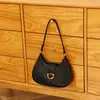 Bolso de axila de nicho de alta gama para mujer, nuevo bolso baguette simple versátil de moda 2025, bolso de hombro vintage para el día a día