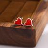Moda corazón pegamento rojo amor pequeño fresco personalidad aretes mujeres venta al por mayor