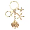 Temu AliExpress Llavero Colgante Estrella de Mar Perla Vieira Cruz Europea Americana Aleación Estrella de Mar Concha Accesorios para Bolsos