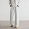 Calça de malha casual preta de perna reta, tendência estilo americano para homens, outono/inverno 2026, patchwork abotoado, calça de moletom com caimento relaxado para homens