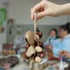 Cascabel Campana de Mano Carrillón Colgante de Bolsa Hecho a Mano Rayo de Sonido Cascabel Colgante Fruta Negra Indonesia Cáscara Fábrica Venta al por Mayor