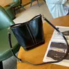 Bolsa feminina de couro genuíno 2026 nova bolsa de balde, bolsa de ombro, axila e transversal versátil de alta qualidade para mulheres