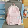 Mochila de Viagem Xadrez Color Block Laço Feminino Estilo Doce Japonês Estudante Duas Alças Primavera Verão 2026