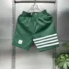 Pantalones cortos hombre marca de moda outdoor Seda de Hielo pantalones casuales pantalones deportivos de cinco puntos a rayas Net Red cuatro barras moda pantalones de playa