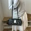 Bolso de hombro lindo de conejo con lunares de moda, nuevo diseño de nicho de moda de verano 2026, simple y versátil