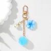Nuevo estilo llavero de flor de pompón, llavero de flor de perla colorida de resina, decoración de bolsa para funda de auriculares, regalo pequeño