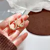 Aretes de aro de pigmento dorado plateado de alta calidad para mujer, aretes de diseño nicho de lujo ligero, aretes nuevos de moda