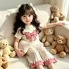 Venta Caliente de Comercio Exterior Conjunto de Manga Corta con Lazo para Niñas, Moda Estilo Coreano para Bebé Niña Verano Delgado Casual Conjunto de Dos Piezas Tendencia