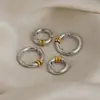 Pendientes de aro simples y versátiles con bloqueo de color transfronterizo, clips para orejas de acero inoxidable con baño de vacío de oro de 18 quilates, pendientes de alta gama al por mayor