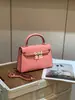 2026 Nova Bolsa Mini Kelly Primavera Verão Segunda Geração 19CM Fivela Dourada Bolsa de Ombro Transversal Bolsa de Mão de Luxo Discreto de Nicho