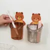 Explosiones de TikTok Oso Abrazador Taza de Almacenamiento Estante de Almacenamiento para Cepillos de Dientes Colgante de Pared Sin Taladro Baño Cepillado Taza de Agua