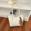Nuevo bolso de axila de alta calidad para principios de otoño de 2026, bolso de hombro simple de gran capacidad, bolso tote para el trabajo, bolsos de mujer al por mayor