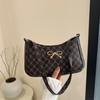 Bolsa de ombro feminina estilo ocidental com costura estilo coreano, tecido moderno e elegante, laço moderno, primavera de 2025