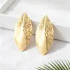 Pendientes de marquise martillados transfronterizos, pendientes de botón de metal martillado irregular tridimensional para mujer, venta directa del fabricante de Qingdao