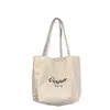 Bolsa tote para o trabalho, grande capacidade para aulas, nova bolsa de lona 2026, versátil para estudantes, uso em ambos os lados, bolsa de ombro simples