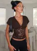 Top de retazos de encaje estilo europeo y americano, nuevo producto de verano 2026, camisola ajustada de color liso con manga corta sexy y escote en V profundo para mujer