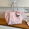 Bolsa de lona con estampado de leopardo para mujer, bolsa de gran capacidad, nuevo modelo 2026, bolso de mano de estrella transfronterizo, bolso de hombro para el trabajo, bolsa versátil