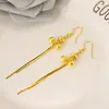 Aretes Chapados en Oro con un Diseño de Moda Único con Estrellas y Notas Musicales, un Accesorio Sencillo de Estilo Largo para Niñas, con Borlas Doradas para un Aspecto Elegante