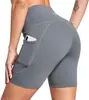 Venta Directa de Fábrica Pantalones de Yoga de Cintura Alta Ajustados Levanta Glúteos Hechos a Medida con Bolsillo Lateral para Teléfono Shorts Deportivos Ajustados para Verano