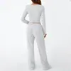 Conjunto Casual Duas Peças para Mulheres - Top Simples de Cor Sólida com Mangas Longas e Calça de Perna Larga com Bolsos - Cruzamento Europeu e Americano 2026