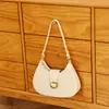 Bolsa de axila de nicho de alta qualidade para mulheres, nova moda 2025, bolsa baguette versátil e simples, bolsa de ombro vintage para o dia a dia