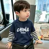 Camiseta de manga larga para niño, nuevo modelo otoño 2026, playera básica de algodón puro para niños, top estiloso para niños, dos piezas para primavera y otoño