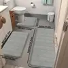 Alfombra de suelo de forro polar de coral acolchada a rayas transfronteriza, juego de tres piezas para inodoro, alfombra absorbente y antideslizante para uso en el baño del hogar