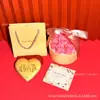 Oro Puro 999 Creativo 520 Qixi Exquisita Moneda de Oro en Forma de Corazón Set de Regalo Decoración del Día de San Valentín Personalizado Venta al por Mayor
