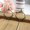 Accesorios de joyería de aleación NIANXING 30*37 mm pendientes cabeza colgante colgante poroso